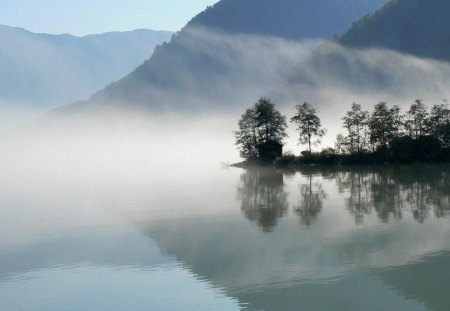 fog on a reflective lake - trees, shore, lake, huts, mountains, fogs