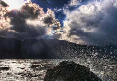 amazing seascape - clouds, rock, sea, sun rays, splash