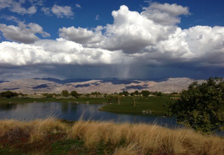 Eagle Falls Golf Course - water, mountains, grass, clouds