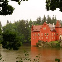 beautiful castle on a lake in rain