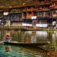 boating down the river in feng huang china hdr