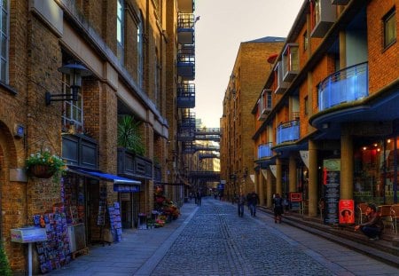 lovely london side street - cobblestones, street, stores, people