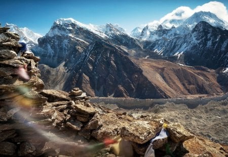 flags flapping before the great himalayas - flags, mountains, movement, rocks