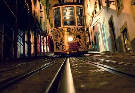 tram down a city hill - street, graffiti, city, track, tram