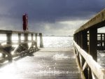 sea splashing through a wooden pier hdr