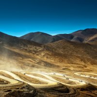 serpentine road in tibet mountains