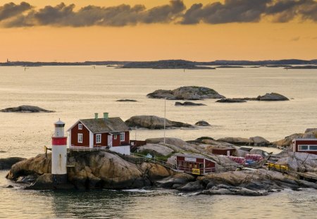 wonderful little lighthouse in sweden - clouds, lighthouse, rocks, bay