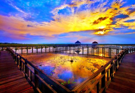 BRILLIANT SUNSET - shore, sunset, sea, huts, reflection, bridge