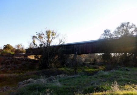 A wooden covered bridge - wooden, bridge, trees, river