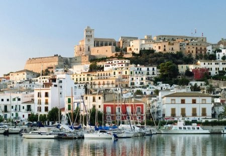 beautiful ibiza spain - hill, boats, town, fortress, seaside