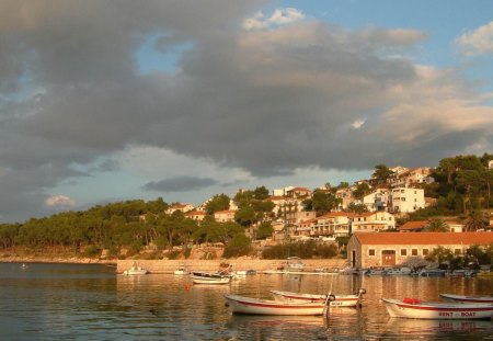 lovely seaside town of jelsa croatia - hill, town, clouds, seaside, boats