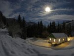 hut in winter forest