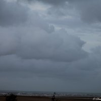 puffs of grey and white storm clouds