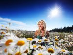 Girl in camomile field