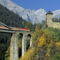 train bridge to a castle in austrian alps