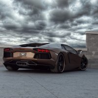 lamborghini aventador under stormy clouds