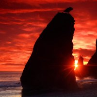 red sunset over beach towers