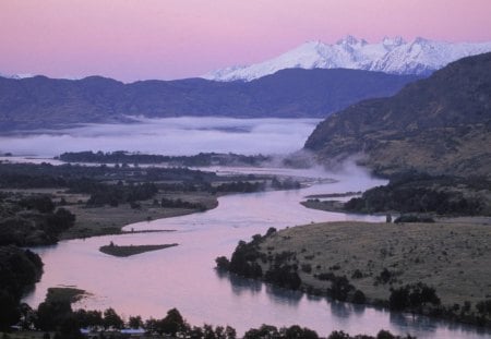 baker river in the chilean patagonia - fog, mountains, pink sky, river