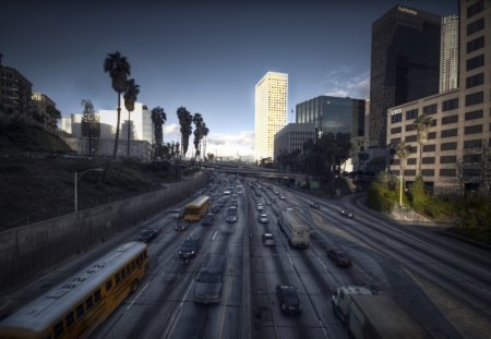 highway through a city - highway, city, vrhicles, traffic