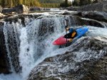 Kayaking over Elbow Falls