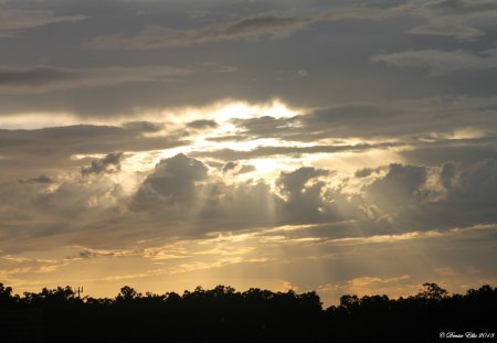 Just after it had been raining - rays, silver, clouds, puffy