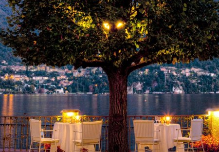 Beautiful Evening - beauty, italy, water, chairs, view, table, romance, house, tree, dinner, lake, houses, italia, nature, romantic, beautiful, lights