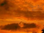 orange sunset over a temple