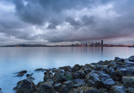 across the bay to seattle hdr - clouds, city, hdr, shore, bay, lights, rocks