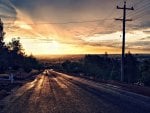 rural road down to a sunset