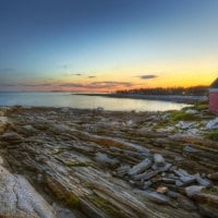 rocky lake shore at sunset hdr