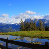 wonderful mountain range above a farm