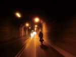 biker riding through a tunnel in taiwan