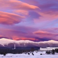 wondrous clouds over winter resort hotel