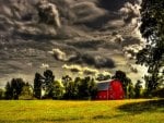 red barn under stormy clouds hdr