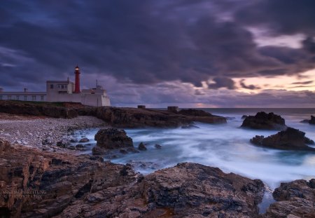 wonderful lighthouse on a portuguese coast - lighthouse, sundown, clouds, rocs, sea, coast