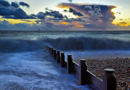 sea waves over breaker at sunset - clouds, sunset, beach, pebbles, waves, sea, breaker