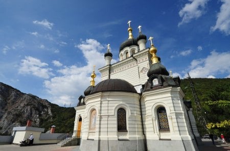 foros orthodox church in yalta - cliff, clouds, gold crosses, church