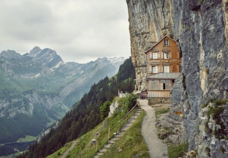 amazing inn imbeded in  a high cliff - cliff, inn, forest, mountains