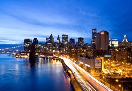 FDR drive on the east side of manhattan - river, highway, lights, dusk, city, bridge