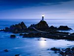 wonderful lighthouse on rocks off shore