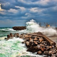 waves smashing on a rocky sea breaker hdr