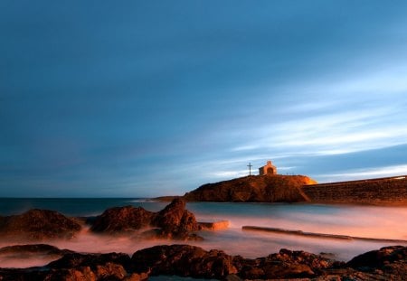 fantastic little chapel on a rocky pier - cross, pier, chapel, shore, sunset, sea, rocks