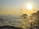 sea wave splashing at sunrise