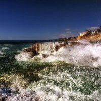 sea waves crashing on rocky shore