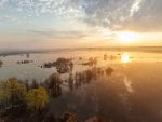 sunset on flooded landscape