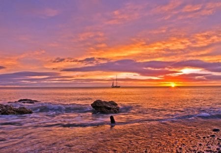 outstanding sunset hdr - beach, sunset clouds, rocks, sailboat