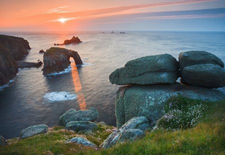 sunlight coming through arched rocks in seacoast - sunset, coast, arch, sea, rocks