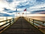 flags waving on a sea pier