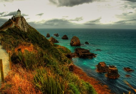 lighthouse on a cliff over rocky coastline hdr - lightouse, coast, cliff, hdr, sea, oath, rocks