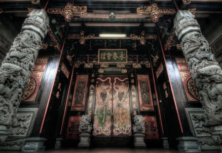 magnificent entry to an oriental temple - doors, paint, columns, statues